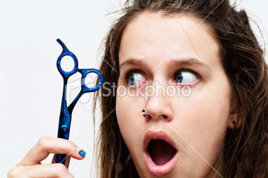I have a LOT of frizz and fly-aways. Is it OK to cut them with scissors to make them manageable?